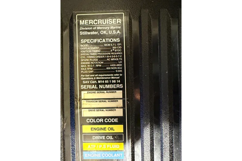 Slide: The Image of ```json { "alt_text": "MerCruiser engine specifications label on 2001 Maxum 3300 SCR boat." } ``` - 34