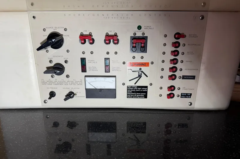 Slide: The Image of Control panel of a 2001 Maxum 3300 SCR boat, featuring various switches and indicators. - 39