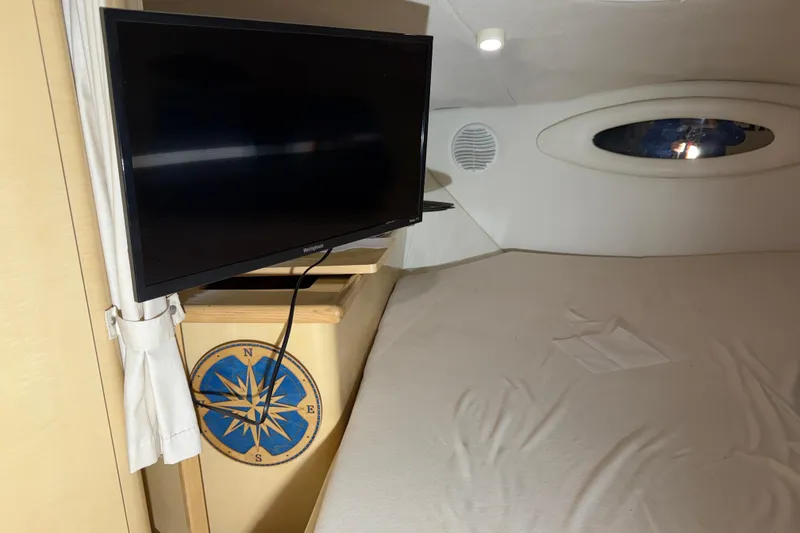 Slide: The Image of Interior of 2001 Maxum 3300 SCR boat with TV and compass design. - 40