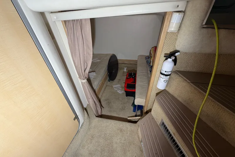 Slide: The Image of Interior cabin of 2001 Maxum 3300 SCR boat with seating and fire extinguisher. - 41