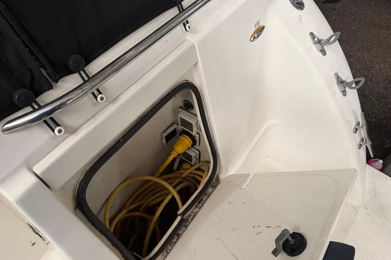 Slide: The Image of 2001 Maxum 3300 SCR boat with open electrical compartment and yellow power cord. - 47