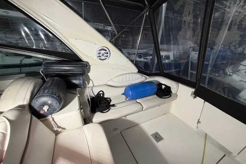 Slide: The Image of Interior of 2001 Maxum 3300 SCR boat with seating and fenders. - 49