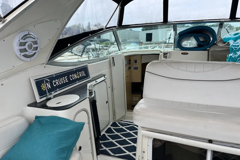 Slide: The Image of Interior of a 2001 Maxum 3300 SCR boat with seating and nautical decor. - 5