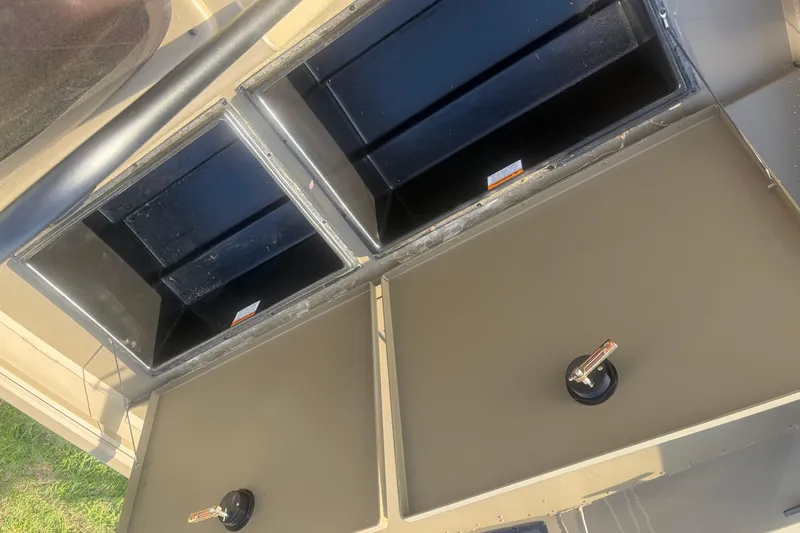 Slide: The Image of Storage compartments on a 2026 G3 Gator Tough Tunnel Jon 18 CCJ boat. - 11