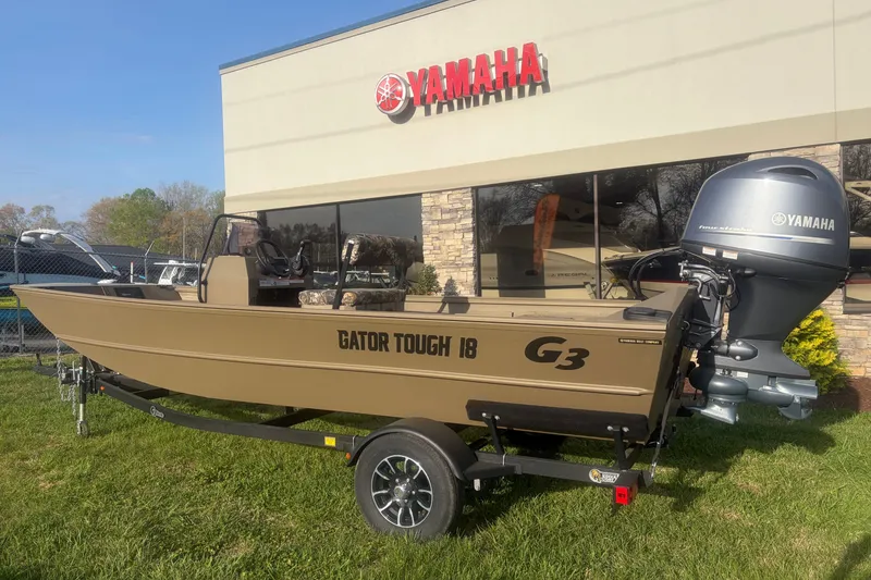 The Image of 2026 G3 Gator Tough Tunnel Jon 18 CCJ boat with Yamaha engine outside dealership. - 3