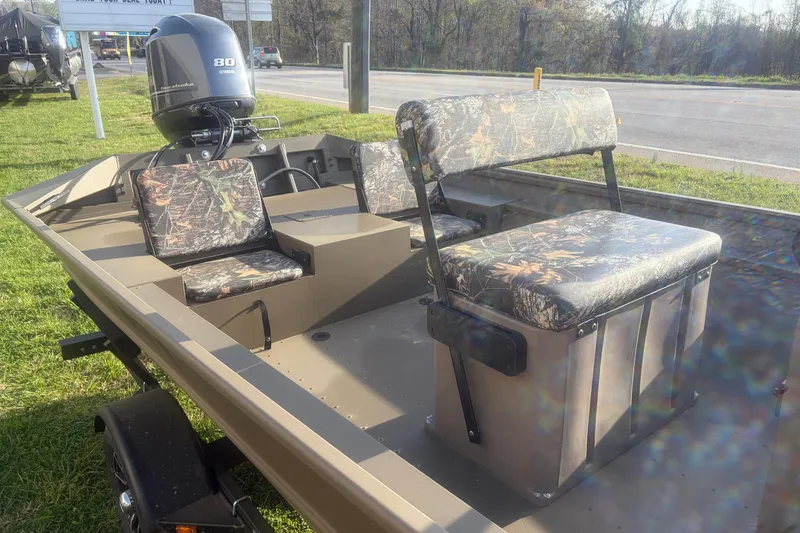 Slide: The Image of 2026 G3 Gator Tough Tunnel Jon 18 CCJ boat with camouflage seating and Yamaha motor. - 7