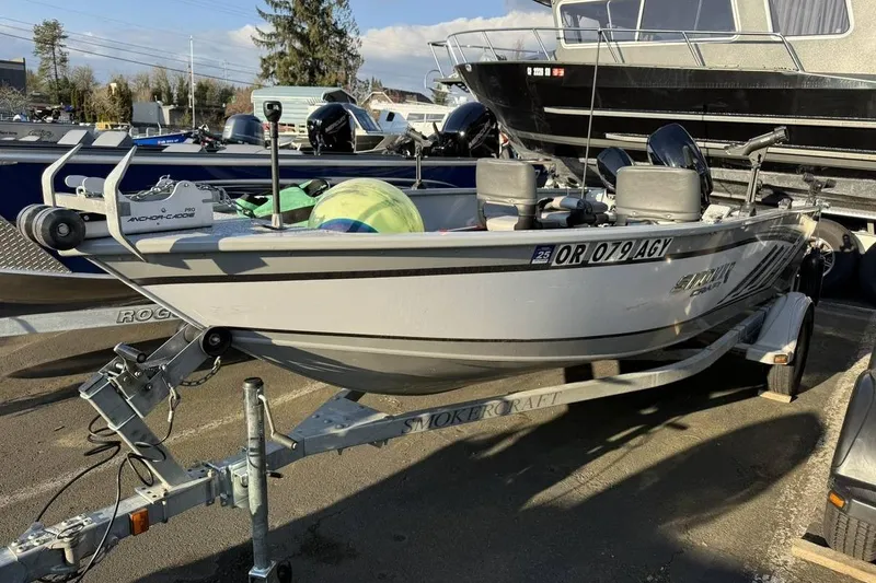 The Image of 2021 Smoker Craft 16 Lodge boat on trailer, parked outdoors. - 1