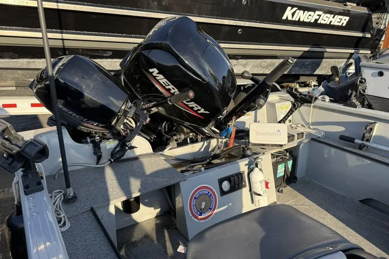 Slide: The Image of 2021 Smoker Craft 16 Lodge boat interior with Mercury engines and Garmin equipment. - 4