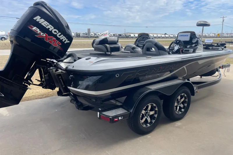 Slide: The Image of 2011 Nitro Z-8 DC boat at marine dealership, featuring dual consoles and seating. - 3
