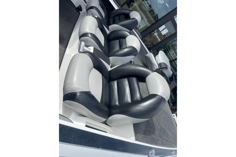 Slide: The Image of 2011 Nitro Z-8 DC boat dashboard with Lowrance electronics and sleek black design. - 6