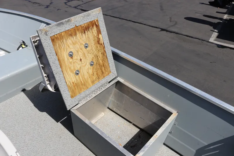 Slide: The Image of 2018 Smoker Craft Alaskan 15 boat with open storage compartment on deck. - 11