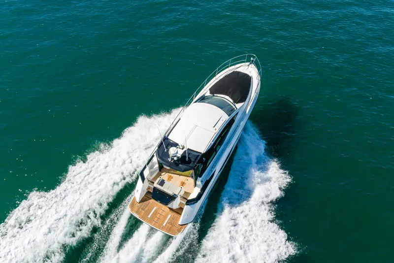 Slide: The Image of 2019 Beneteau Gran Turismo 46 yacht cruising on open water, aerial view. - 13