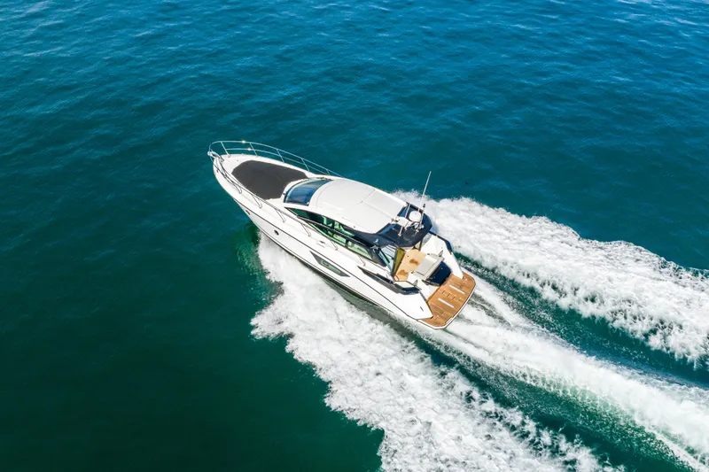 Slide: The Image of 2019 Beneteau Gran Turismo 46 yacht cruising on open water, aerial view. - 14