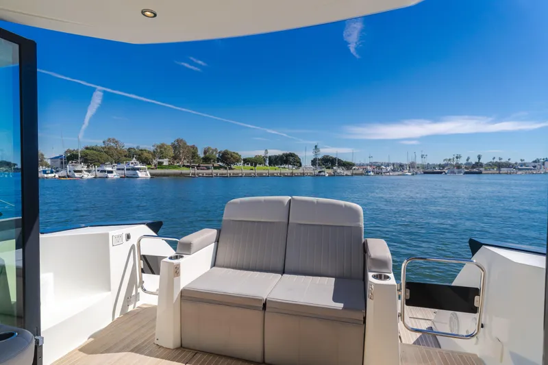 Slide: The Image of 2019 Beneteau Gran Turismo 46 yacht with scenic marina view. - 18