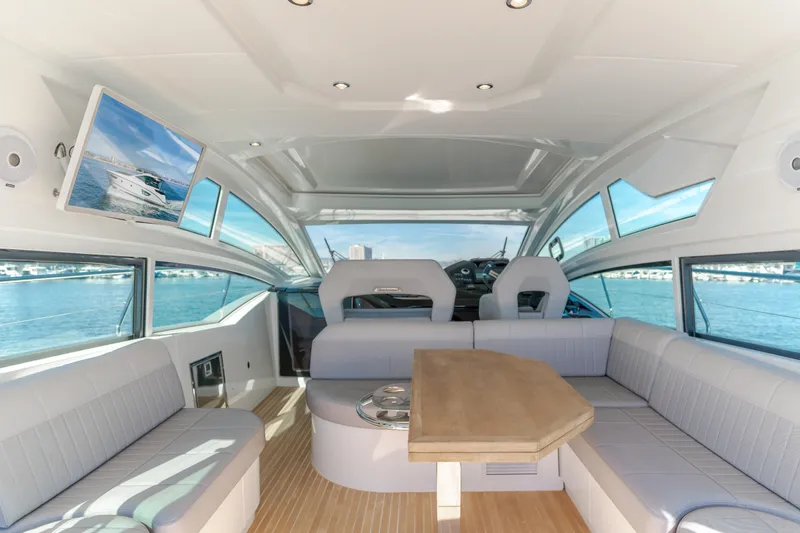 Slide: The Image of Luxurious interior of 2019 Beneteau Gran Turismo 46 yacht with panoramic windows and seating. - 19
