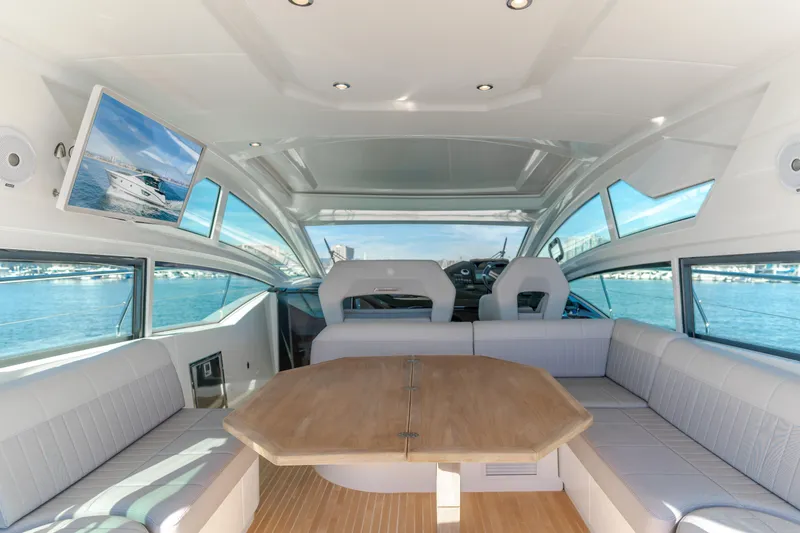 Slide: The Image of Interior of 2019 Beneteau Gran Turismo 46 yacht with luxurious seating and panoramic windows. - 20