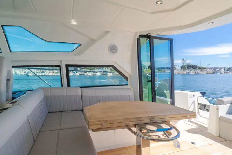 Slide: The Image of Interior view of 2019 Beneteau Gran Turismo 46 yacht with waterfront scenery. - 21