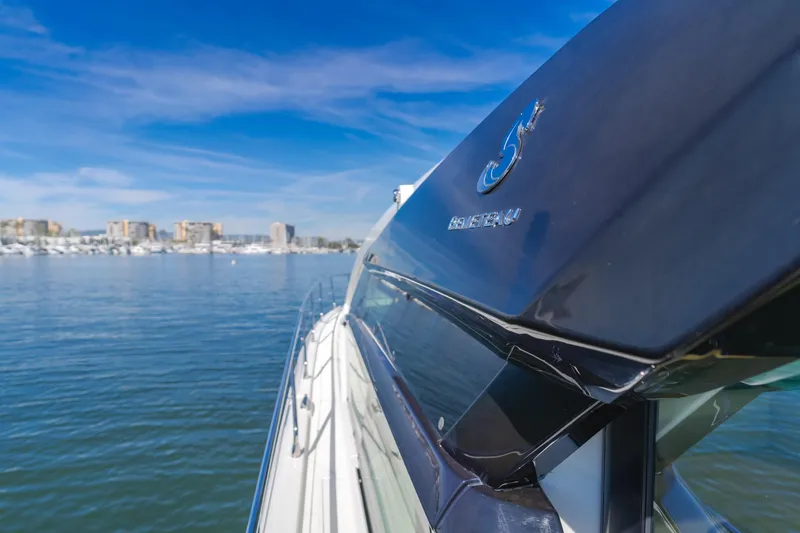 Slide: The Image of 2019 Beneteau Gran Turismo 46 yacht cruising on a sunny day near a marina. - 25
