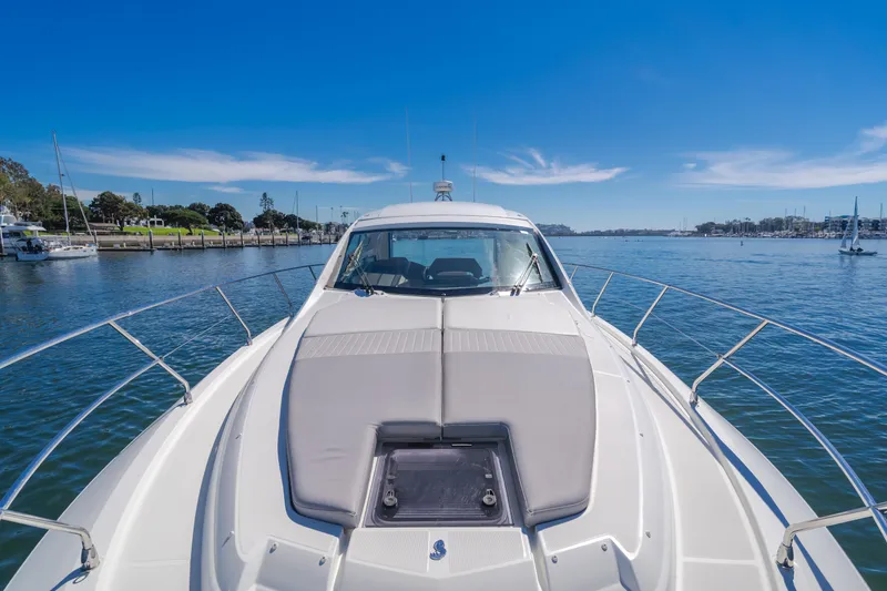 Slide: The Image of 2019 Beneteau Gran Turismo 46 yacht on calm waters under clear blue sky. - 27