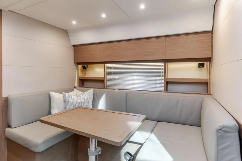 Slide: The Image of Interior of 2019 Beneteau Gran Turismo 46 yacht with modern seating and wooden accents. - 28