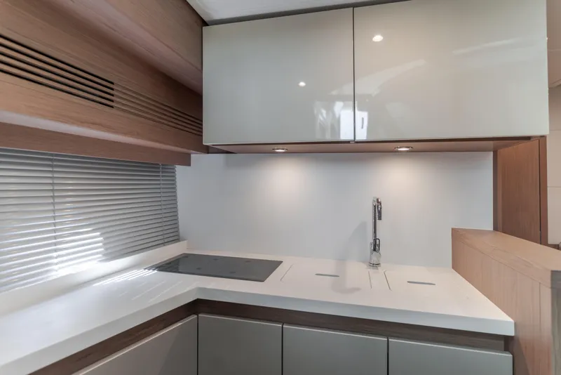 Slide: The Image of Modern kitchen interior of 2019 Beneteau Gran Turismo 46 yacht with sleek cabinetry. - 31