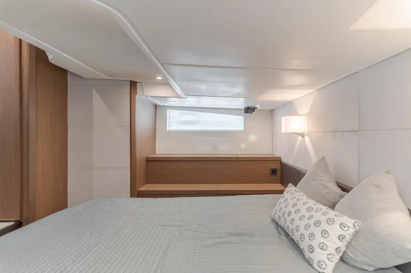 Slide: The Image of Luxurious cabin interior of 2019 Beneteau Gran Turismo 46 yacht, featuring modern design and cozy bedding. - 35