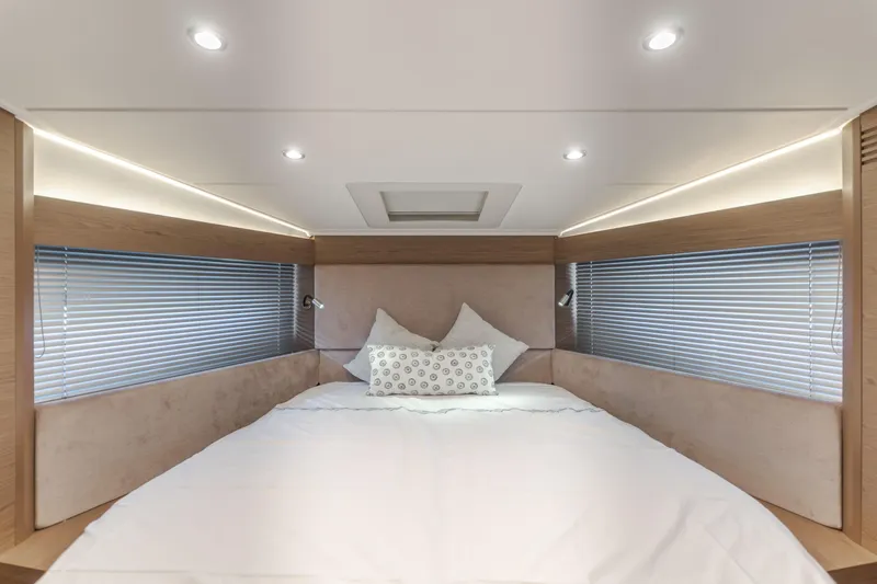 Slide: The Image of Luxurious cabin interior of 2019 Beneteau Gran Turismo 46 yacht with modern lighting. - 38
