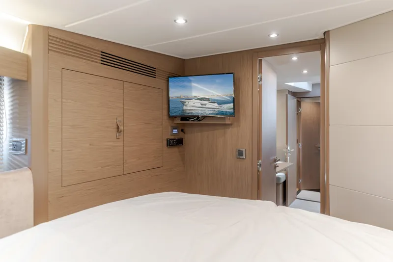Slide: The Image of Luxurious interior of 2019 Beneteau Gran Turismo 46 yacht cabin with TV and ensuite bathroom. - 39