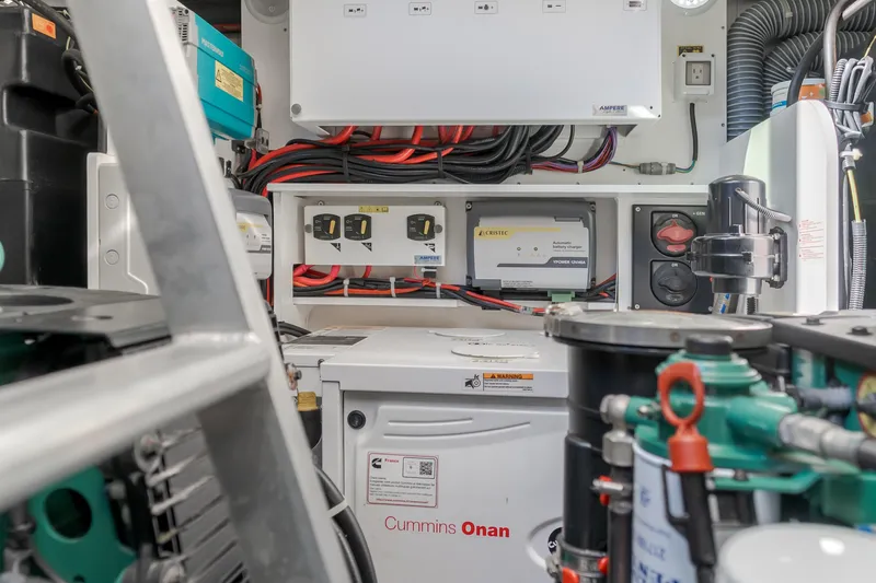 Slide: The Image of Engine room of 2019 Beneteau Gran Turismo 46 with Cummins Onan generator and wiring. - 43