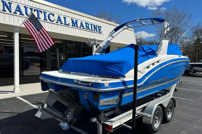 Slide: The Image of 2017 Chaparral 227 SSX Surf boat in blue, parked at Nautical Marine dealership. - 16