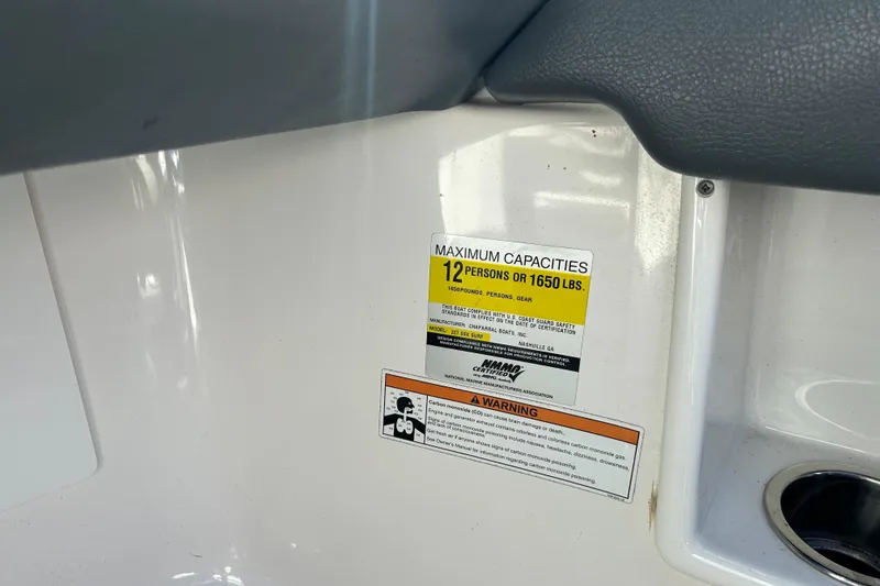Slide: The Image of Capacity label on 2017 Chaparral 227 SSX Surf boat, indicating 12 persons or 1650 lbs. - 18