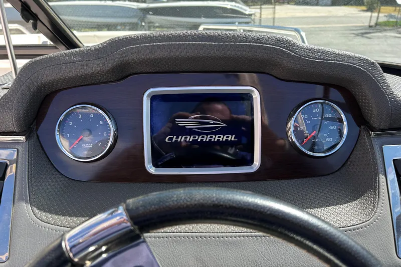 Slide: The Image of Dashboard of 2017 Chaparral 227 SSX Surf boat with gauges and logo. - 20