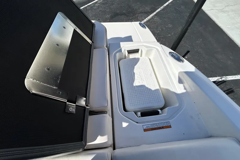 Slide: The Image of 2017 Chaparral 227 SSX Surf boat with built-in cooler and seating area. - 22