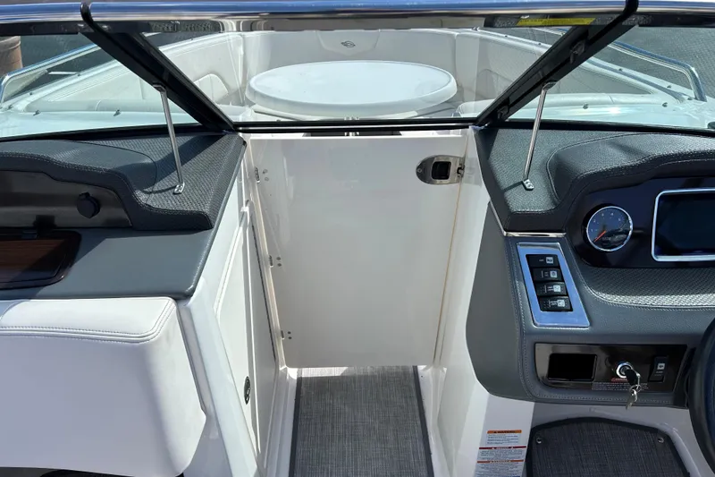 Slide: The Image of 2017 Chaparral 227 SSX Surf boat interior with dashboard and seating area. - 26
