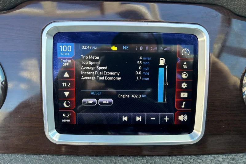 Slide: The Image of Dashboard display of a 2017 Chaparral 227 SSX Surf boat showing trip and fuel data. - 28