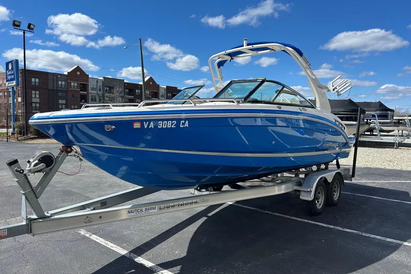 Slide: The Image of 2017 Chaparral 227 SSX Surf boat on trailer, parked outdoors under blue sky. - 3