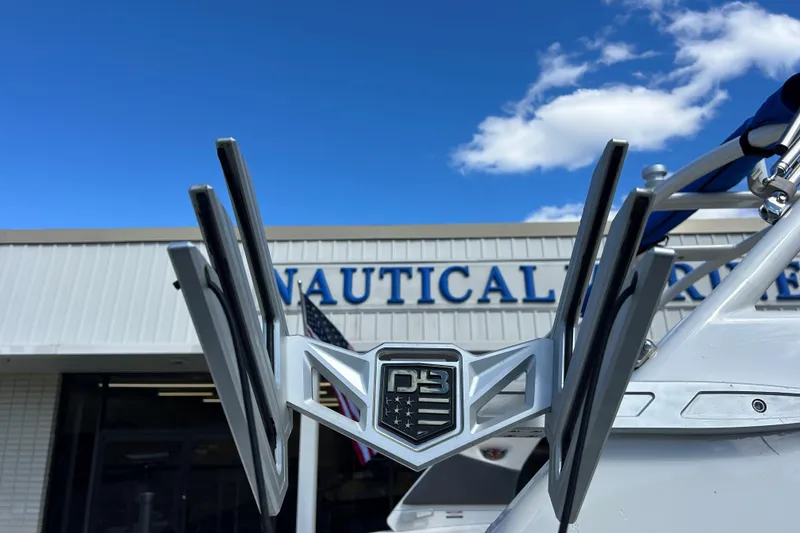 Slide: The Image of 2017 Chaparral 227 SSX Surf boat detail with nautical store background. - 30