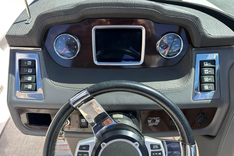 Slide: The Image of Dashboard of 2017 Chaparral 227 SSX Surf boat with steering wheel and gauges. - 32