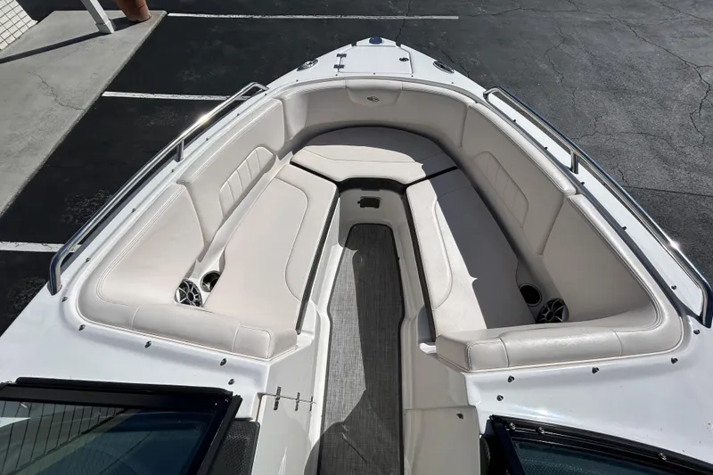 Slide: The Image of 2017 Chaparral 227 SSX Surf boat interior with white seating and speakers. - 33