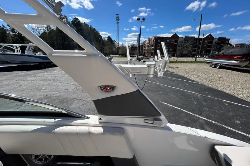 Slide: The Image of 2017 Chaparral 227 SSX Surf boat interior with wakeboard tower, parked outdoors. - 35