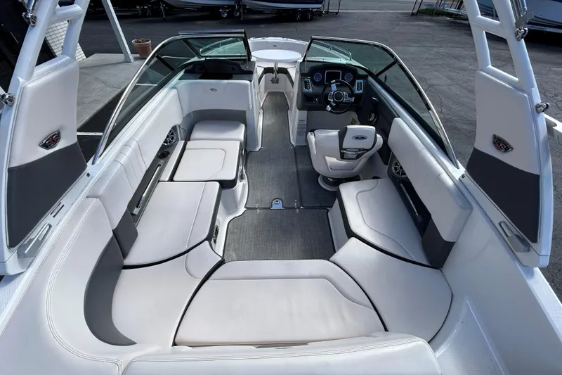 Slide: The Image of 2017 Chaparral 227 SSX Surf boat interior with spacious seating and modern dashboard. - 37