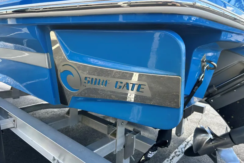 Slide: The Image of 2017 Chaparral 227 SSX Surf boat with Surf Gate feature, blue exterior. - 5