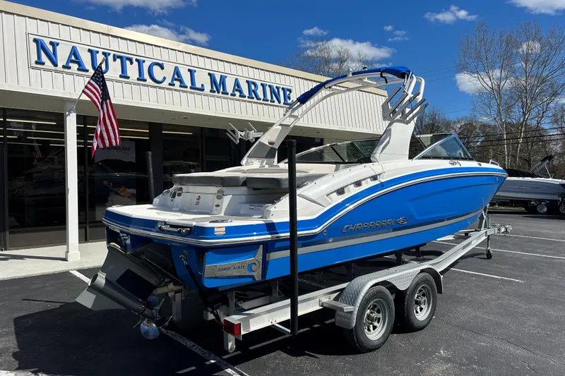 Slide: The Image of 2017 Chaparral 227 SSX Surf boat on trailer at Nautical Marine dealership. - 9