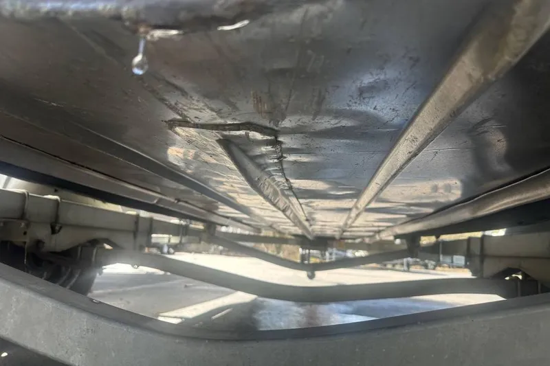 Slide: The Image of Underside view of 2002 Smoker Craft Sportsman 1860 DLX boat on trailer. - 10