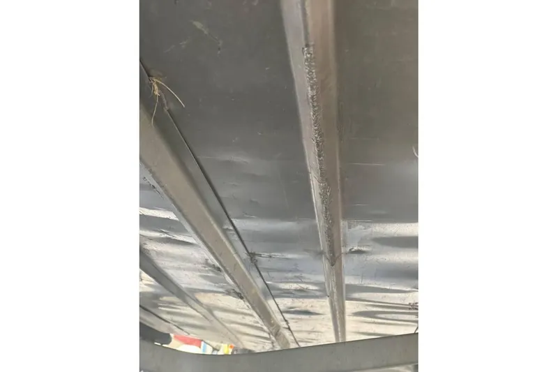 Slide: The Image of Underside view of 2002 Smoker Craft Sportsman 1860 DLX boat hull. - 12