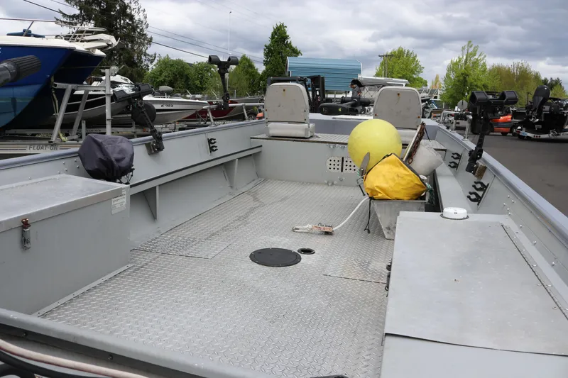 Slide: The Image of 2002 Smoker Craft Sportsman 1860 DLX boat interior with seating and equipment. - 8