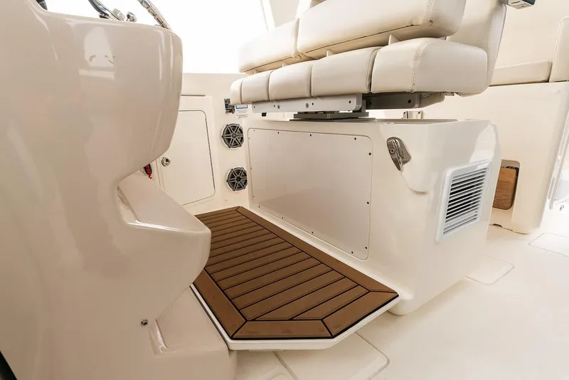 Slide: The Image of Manufacturer Provided Image: 2022 Boston Whaler 380 Realm interior seating and deck area. - 13