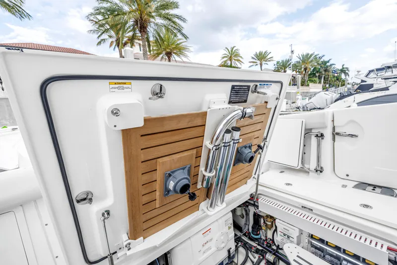 Slide: The Image of Boston Whaler 380 Realm 2022 boat interior with open hatch and equipment. - 31