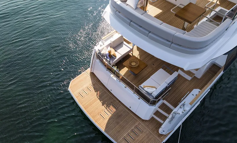 Slide: The Image of Luxury Sirena 48 yacht, 2025 model, with spacious deck and elegant seating area. - 15