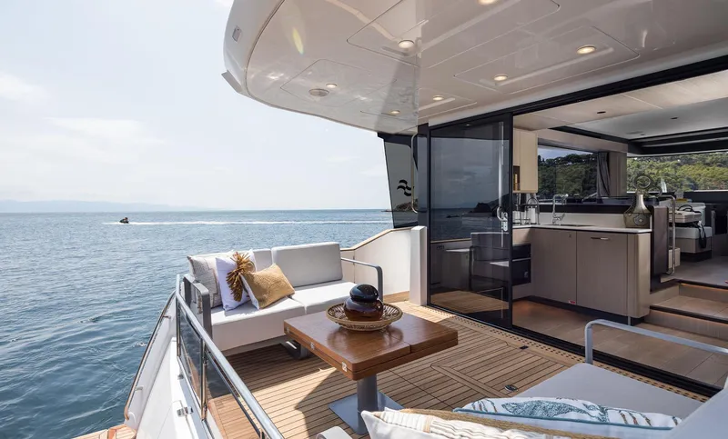 Slide: The Image of Luxurious Sirena 48 yacht deck with modern seating and ocean view, 2025 model. - 17